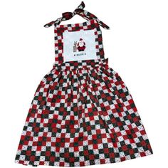 a red and black checkered dress with a santa clause on the chest, in front of a white background