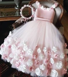 a pink dress with white flowers on it