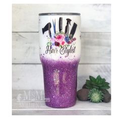 a purple glitter tumbler with hair stylist on it and flowers in the background