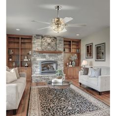 a living room filled with furniture and a fire place