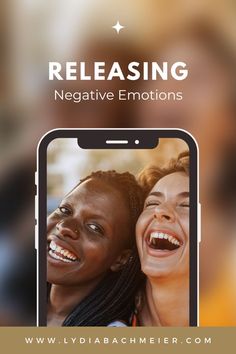 two women laughing together with the text releasing negative emotions