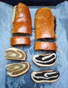 several slices of bread are cut in half and placed on a piece of blue paper