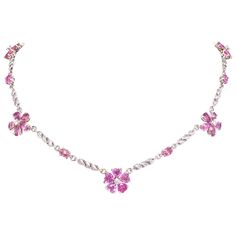 The pink sapphire and diamond necklace features 5 flowers with drop, oval and heart shaped sapphires of lovely color crystalline texture for a total weight of 16.90 carats. The design is complete with 0.49 carats of round diamonds of top quality (F/G-VVS). The necklace is one-of-a-kind. It was handmade in Italy in our own workshop by maestro Scalabrì according to an original design by Ella Gafter. The item is signed EG. Heart Shaped Gemstones, Luxury Pink Gold Pink Sapphire Necklaces, Luxury Pink Gold Necklaces With Pink Sapphire, Pink Diamond Necklace 1stdibs, Pink Gem Necklace, Sibling Challenge, Pink Sapphire Necklace, Pink Sapphire Jewelry, Sapphire Diamond Necklace