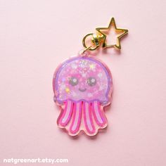 a pink jellyfish keychain with a star on it