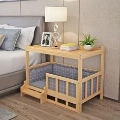 a bedroom with a bed, nightstand and night stand next to it on the floor