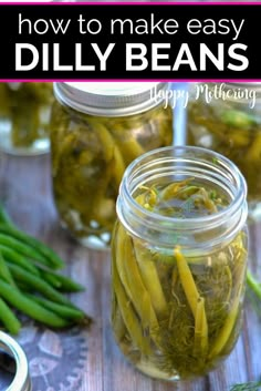 jars filled with pickled beans and green beans on top of a wooden table next to other