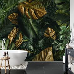 a bath tub sitting next to a wall covered in green plants and leaves on it