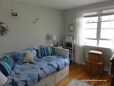 a living room with a couch and window