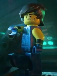 the lego movie character is standing in front of a keyboard