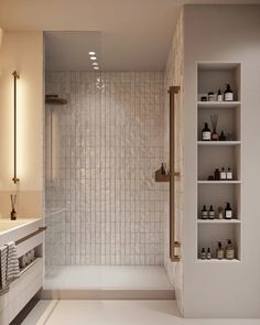 a white tiled bathroom with shelves on the wall