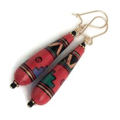 Colorful, teardrop earrings with hand-painted, Peruvian, ceramic beads.  Here, a bold, geometric design is applied to a tomato-red background.  Each colorful clay bead is hand-rolled, hand-finished, and a unique piece of folk art.  From new, old-stock, the vintage beads were made in Peru, and carefully matched for size and shape in my studio before being made into earrings.   Quality 14K Gold filled ear wires - choose from kidney or French.  14K gold filled head pins.  Overall length is 1 7/8". Handmade Artisan Teardrop Earrings, Artisan Teardrop Earrings For Gift, Bohemian Teardrop Hand Painted Earrings, Folk Art Jewelry, Bead Dangles, Color Ceramic, Port Townsend, Clay Bead, Vintage Beads