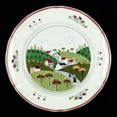 an image of a plate with animals and houses painted on the front, along with red trimmings