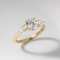 three stone diamond ring on white background