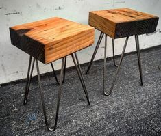 two wooden tables sitting on top of metal legs