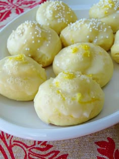 some lemon cookies are on a white plate