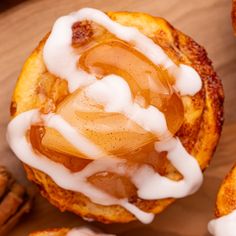 some cinnamon rolls with icing on top of them