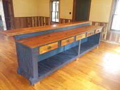 a large wooden table sitting on top of a hard wood floor