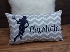 a pillow with a girl holding a tennis racquet on it