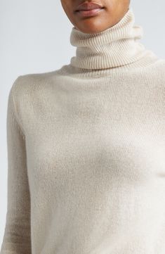 Supremely soft cashmere warms a fitted sweater knit in Italy with a tall turtleneck and deeply ribbed trim. Turtleneck Long sleeves Ribbed cuffs and hem 100% cashmere Dry clean Made in Italy Designer Clothing Elegant Winter Turtleneck With Ribbed Collar, Elegant Ribbed Collar Turtleneck For Winter, Elegant Ribbed Turtleneck For Winter, Classic Cashmere Turtleneck With Ribbed Cuffs, Elegant Cashmere Funnel Neck Turtleneck, Luxury Fitted Sweater With Ribbed Cuffs, Elegant Ribbed Wool Turtleneck, Elegant Fitted Sweater With Ribbed Cuffs, Elegant Fitted Turtleneck With Ribbed Cuffs