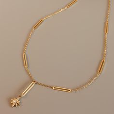 ✦ Dazzle with celestial charm in our Star Pendant Chain Necklace, luxuriously plated in 18K gold. Crafted to captivate, this necklace features a timeless star pendant suspended from a delicate chain. Elevate your ensemble with celestial elegance, whether worn alone for understated sophistication or layered for a trendsetting statement.----------- DETAILS ----------- - Color: Gold - Pattern: Star Pendant/ Ball Pendant - Chain Length: 45cm - Materials: 18K Gold Plated, 316L Surgical Steel, Cubic Z Elegant Gold Plated Charm Necklaces With Star Charm, Elegant Star-shaped Chain Necklace With Star Charm, Elegant Star Charm Necklace, Tarnish Resistant, Elegant Gold Plated Charm Necklace With Star, Elegant Star-shaped Tarnish Resistant Charm Necklace, Elegant Gold Chain Necklace With Star Charm, Half Chain Necklace, Pendant Ball, Delicate Chain