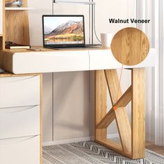 a laptop computer sitting on top of a wooden desk next to a white cabinet and drawers