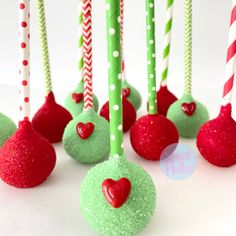 green and red cake pops with candy hearts on them