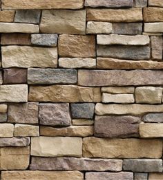 a stone wall that is made out of different colors