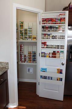 the pantry door is open to reveal what's inside