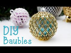 an ornament made out of wire and beading with the words diy baubles