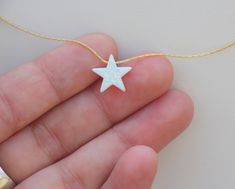 "Beautiful sparkly white Opal star charm pendant necklace. The Opal stone size is 12mm and it glides freely along a chosen chain metal. The dainty star sparkle beautifully in the light! Brilliant and simply cute necklace that make the perfect little gift of happiness for both women, teens and girls. Great bridesmaid gift! Opal stone is also October Birthstone. Jewelry is made from excellent quality materials and will last for years to enjoy. Necklace chain can be made of 925 Sterling Silver / 14 White Star Of David Charm Jewelry, White Star Of David Jewelry Gift, White Star-shaped Jewelry With Adjustable Chain, White Star Charm Pendant Necklace, White Pendant Necklace With Star Charm, White Star Charm Necklace For Gifting, White Star Charm Necklaces For Gift, White Star Charm Necklace For Gift, White Star Charm Necklace Gift