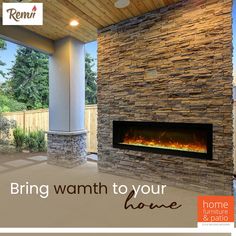 an outdoor fireplace in the middle of a covered patio with grass and trees behind it