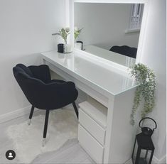 a white desk with a mirror and chair