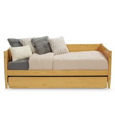 a wooden daybed with four pillows on it