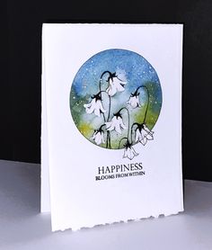 a card with flowers and the words happiness on it