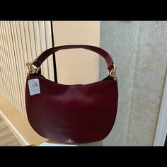 Brand New Large Leather Hobo Ready For Immediate Pick Up, (2) Available Sold Separately Formal Coach Hobo Bag, Elegant Coach Hobo Bag For Formal Occasions, Luxury Formal Coach Hobo Bag, Elegant Burgundy Leather Hobo Bag, Elegant Coach Hobo Bag In Soft Leather, Elegant Coach Soft Leather Hobo Bag, Elegant Coach Hobo Bag With Leather Handles, Elegant Burgundy Hobo Bag With Removable Pouch, Elegant Coach Hobo Bag With Gold-tone Hardware