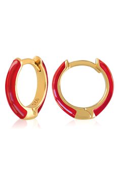 Easy-to-wear hoop earrings will add significant polish to even your most casual ensembles. 1/2" drop; 1/8" width Hinge with snap-post closure Sterling silver with goldtone plate/enamel Imported Red Enamel Clip-on Jewelry, Hoop Huggie Earrings In Enamel, Small Red Hypoallergenic Hoop Earrings, Adjustable Red Hoop Earrings, Trendy Enamel Hoop Jewelry, Trendy Small Hoop Red Earrings, Red Pierced Hoop Earrings, Trendy Small Red Hoop Earrings, Red Hypoallergenic Hoop Jewelry