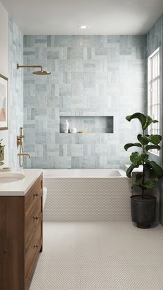 a bathroom with a tub, sink and mirror