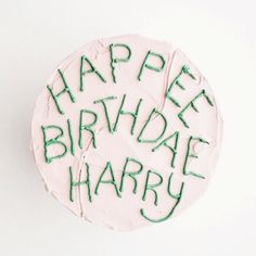 a birthday cake with the words happy birthday harry written on it