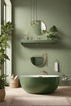 a bathroom with green walls and a round bathtub in the middle, surrounded by potted plants