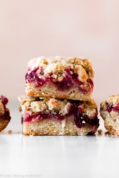 three cranberry crumble bars stacked on top of each other with the words cranberry crumble bars above them