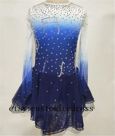 a blue and white figure skating dress with sequins