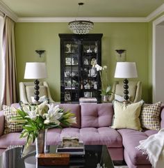 a living room filled with furniture and lamps