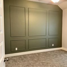 empty room with green walls and carpeted flooring in an apartment or home remodel