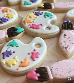 some decorated cookies are sitting on a table