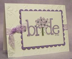 a white card with purple flowers and the words bride to be written on it's front