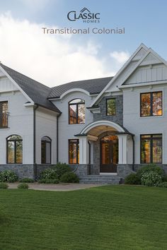 A house in white brick with grey stone water table and center gable, curved portico, dark arched windows and roof details. Arched Windows Exterior, White Colonial House Exterior, Transitional Colonial, White Colonial House, Portico Entry, Home Design Features, Colonial House Exteriors, White Colonial