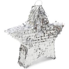 a silver star shaped ornament sitting on top of a white table