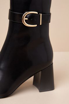 Strut into the changing season with chic confidence in the Lulus Joplynn Black Patent Buckle Ankle Boots! Sleek, faux patent leather shapes these stylish lil' boots with a squared, pointed-toe upper and seaming at the center that rises to an ankle-high shaft. An adjustable, gold buckle strap accents the outstep, while an 8"" zipper at the instep makes for easier on-and-off. Sturdy block heel completes the look! 2. 75" wrapped block heel. Cushioned insole. Rubber sole has nonskid markings. Man ma Trendy Low Heel Boots For Formal Occasions, Trendy Formal Heeled Boots With Low Heel, Trendy Patent Leather Heeled Boots Medium Width, Trendy Formal Heeled Boots In Faux Leather, Trendy Formal Faux Leather Heeled Boots, Chic Spring Boots With Buckle Closure, Chic Faux Leather Ankle Boots, Elegant Fitted Patent Leather Platform Boots, Trendy Formal Heeled Boots For Fall