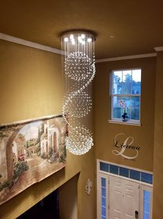 a chandelier hanging from the ceiling in a hallway