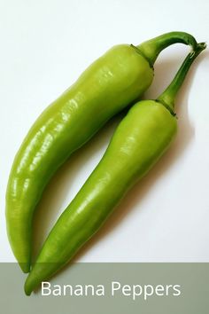 two green peppers sitting next to each other on a white counter top with the words banana peppers written below it